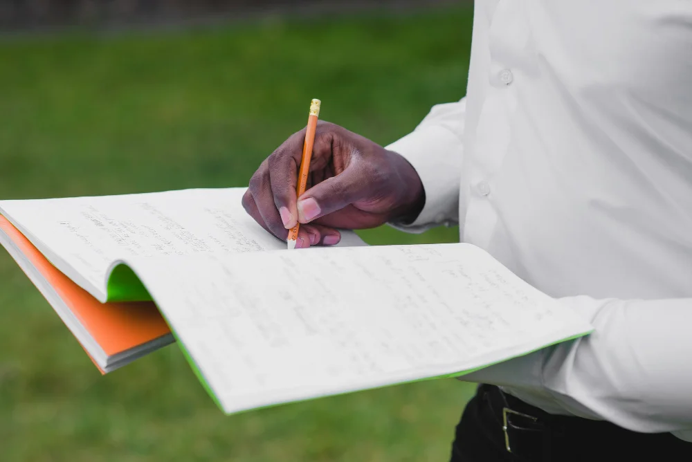 Candidate holding notebook